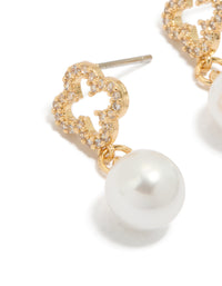 Beautifully crafted floral pearl cubic zirconia outlined flower gold plated earrings in white and gold close up view - link has visual effect only