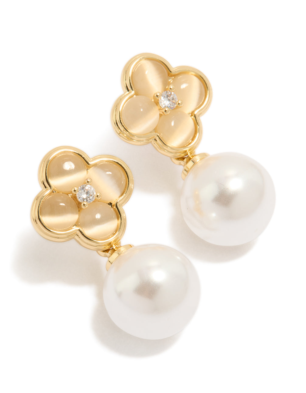 Crafted from gold plated metal, these pearl and flower drop earrings feature floral design in white and ivory tones front view
