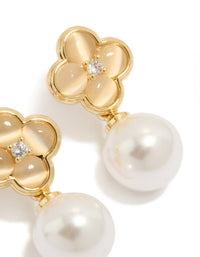 Featuring gold plated pearl and flower drop earrings with floral design in white and ivory tones detail view - link has visual effect only
