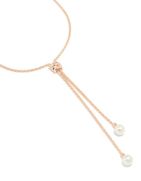 Crafted from rose gold plated metal, this pearl twist chain adjustable Y-necklace features statement details close up view - link has visual effect only