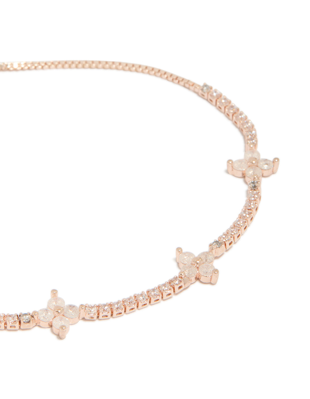 Highlighting a rose gold plated cubic zirconia flowers toggle bracelet close up view