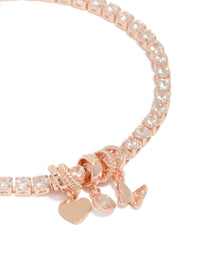 Crafted from rose gold plated cubic zirconia mixed charm tennis bracelet with butterfly and heart charms close up view - link has visual effect only