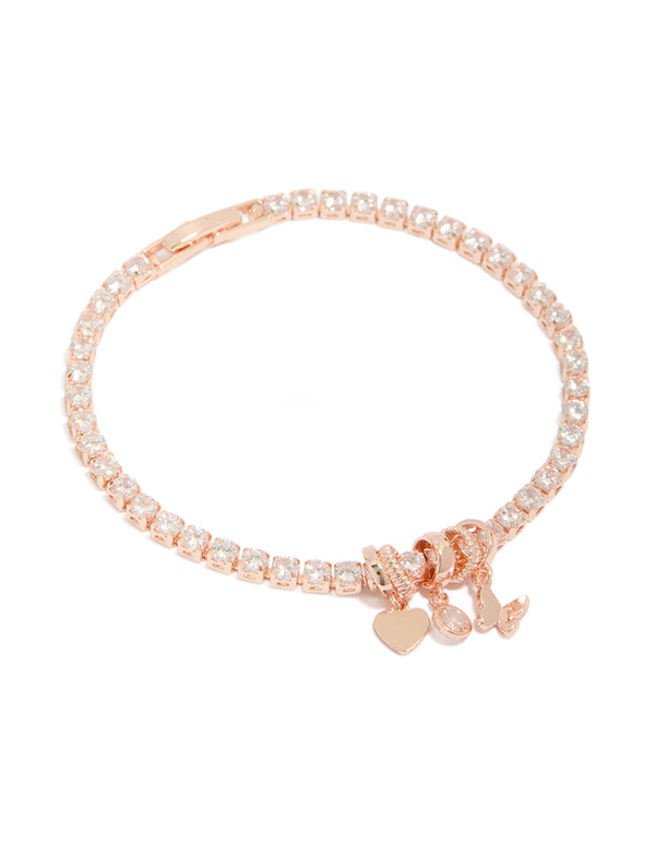 Featuring a rose gold plated cubic zirconia mixed charm tennis bracelet with butterfly and heart charms front view