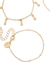 Featuring gold pearl and light blue cord bracelets in a 4-pack with celestial star, moon details close up view - link has visual effect only
