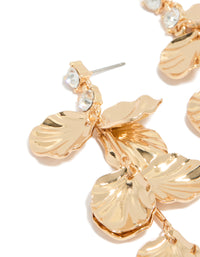 Featuring gold diamante and molten textured petal drop earrings with floral design in statement style close up view - link has visual effect only