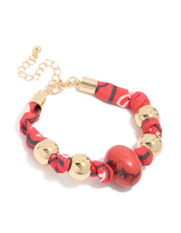 Featuring gold and red bead accents, this wrapped bracelet with stones front view - link has visual effect only