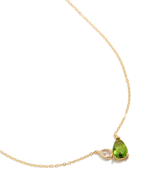 Showcasing a gold plated August green cubic zirconia pendant necklace featuring with crystal accents close up view