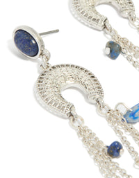 Showcasing statement silver drop earrings with crescent design, beaded details, semi precious stones and tassel accents close up view - link has visual effect only