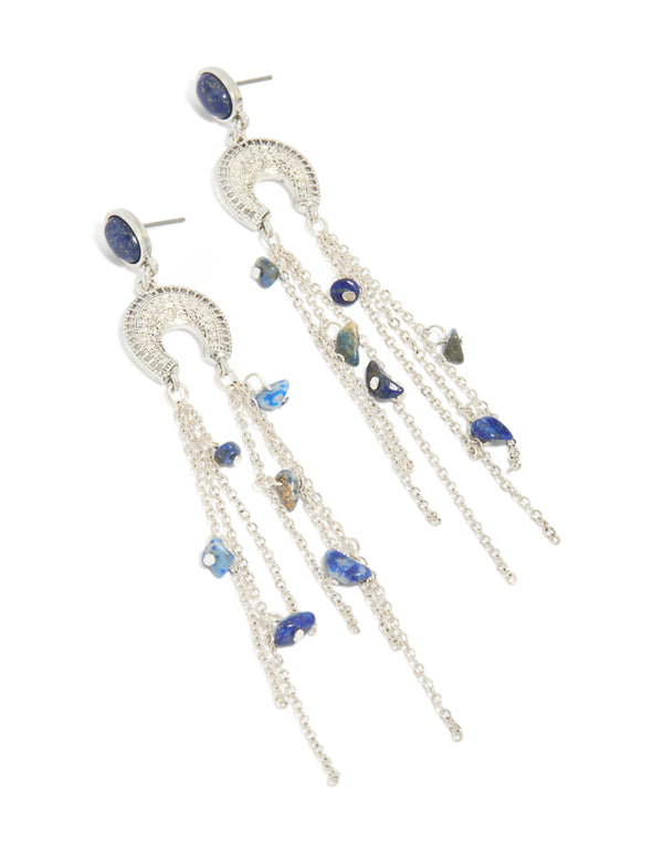 Featuring statement silver drop earrings with crescent design, beaded details, semi precious stones and tassel accents front view
