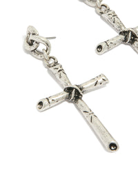 Featuring antique silver edgy textured cross drop earrings with chunky styling close up view - link has visual effect only