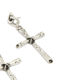 Highlighting antique silver edgy textured cross drop earrings with chunky styling post detail view - link has visual effect only
