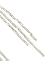 Detailed view of dainty silver drop earrings featuring celestial moon with black gemstone accents and tassel chain detailing post detail view - link has visual effect only