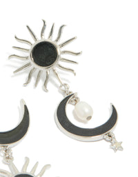 Highlighting statement silver black drop earrings featuring moon and sun celestial design with pearl accents in post detail view - link has visual effect only