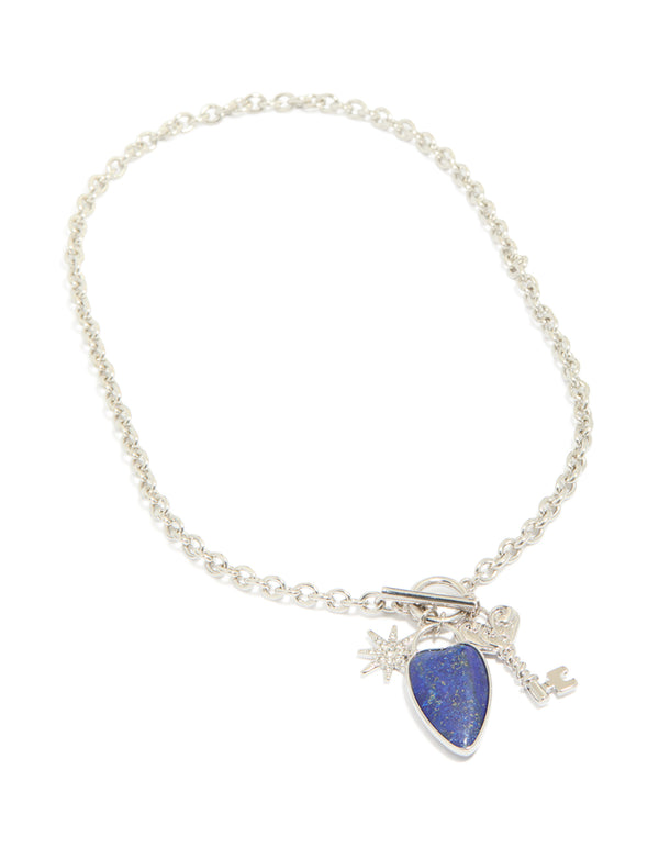 Explore this silver diamante and blue stone heart chunky style necklace with celestial charms featuring star pendant front view