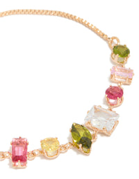 Stunning gold pink and green mismatched cubic zirconia toggle bracelet close up view - link has visual effect only