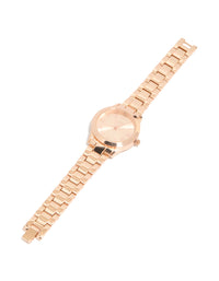 Elegant rose gold classic round roman numeral watch featuring numbers, pink dial, women's link band, formal occasion, analog timepiece front view - link has visual effect only
