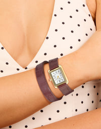 Explore a women's analog watch featuring white roman rectangle dial, brown leather strap, and gold PU construction designed for formal occasions on wrist view - link has visual effect only