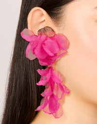 Featuring hot pink fabric flower drop earrings with statement design on ear view - link has visual effect only
