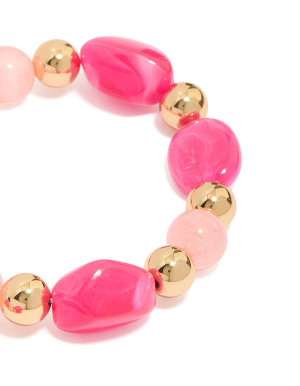 Featuring beaded stretch bracelet in hot pink, light pink, and gold acrylic 2-pack close up view