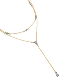 Showcasing a mixed metal teardrop diamante drop Y-necklace crafted from plated material in statement style close up view - link has visual effect only
