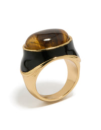 Featuring a gold plated brown stone and black enamel ring in statement style close up view - link has visual effect only