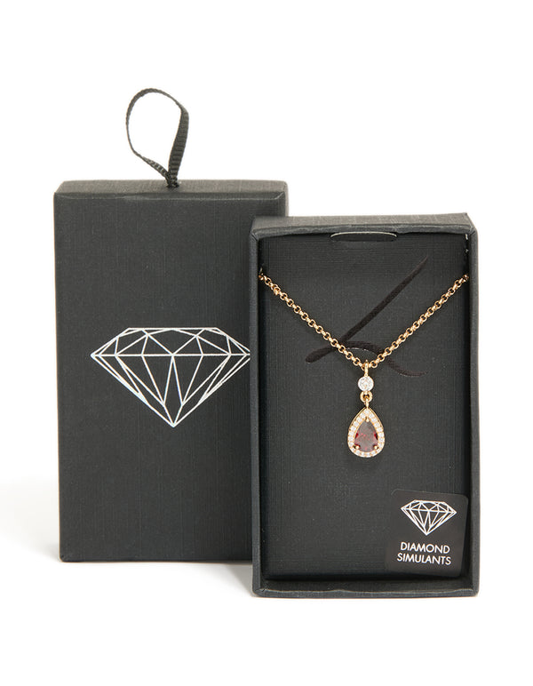 Beautifully crafted gold red pear cubic zirconia pendant necklace with statement design front view