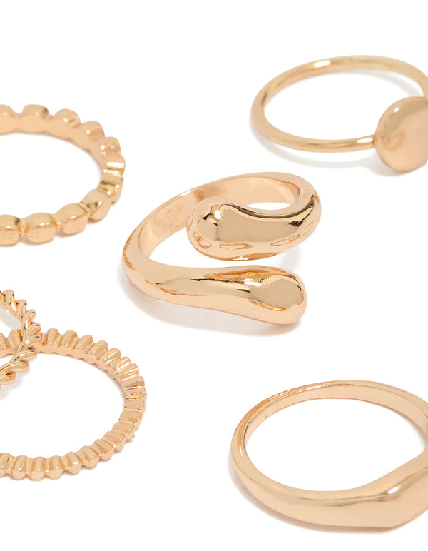 Showcasing thin wrap circle and rectangle signet rings 8-pack in gold with dainty style close up view