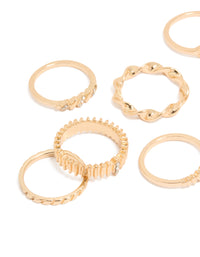 Crafted with a ten-pack of gold signet and ribbed statement rings featuring celestial star details close up view - link has visual effect only