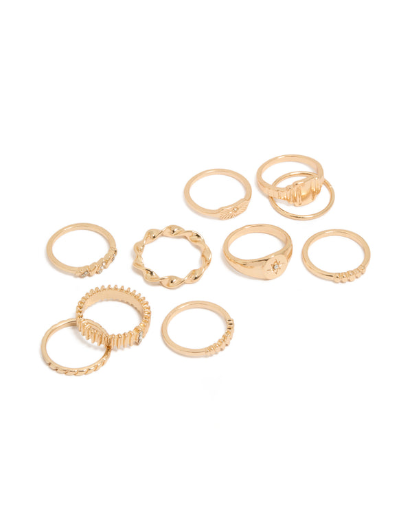 Showcasing a ten-pack of gold signet and ribbed statement rings celestial star details front view
