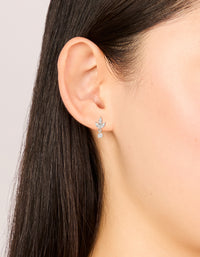 Waterproof stainless steel flower cubic zirconia flat back studs in dainty silver and clear stone on ear view - link has visual effect only