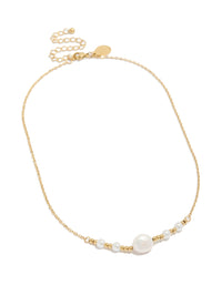Introducing a waterproof statement necklace crafted from stainless steel featuring beads and pearl accents in gold plated and white tones front view - link has visual effect only