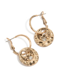 Showcasing gold round disc huggie earrings front view - link has visual effect only