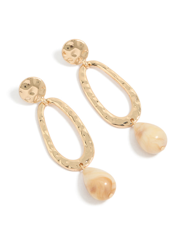 Beautifully crafted hollow round beaded drop earrings in gold with statement style front view