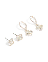 Showcasing floral diamante stud and huggie earrings set in silver with clear stones, 2-pack front view - link has visual effect only