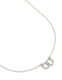Showcasing a joined circles pendant necklace in silver close up view - link has visual effect only