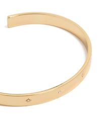 Elegant celestial star diamante wrist cuff in gold plated finish close up view - link has visual effect only