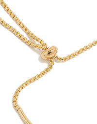 Finely detailed gold plated cubic zirconia and flower charms toggle bangle with oval stone crystal accents closure detail view - link has visual effect only
