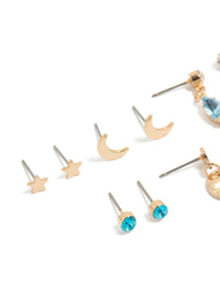Beautifully crafted blue diamante celestial earrings showcasing disc, star, and moon in gold in close up view - link has visual effect only