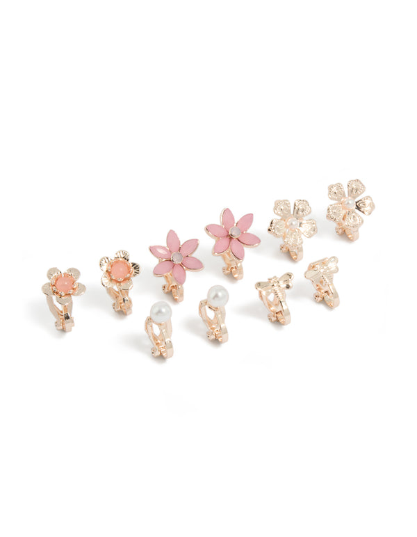 Featuring clip-on earrings in a 5-pack with floral design, pearl accents, and rose gold finish front view