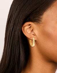 Showcasing gold plated skinny teardrop hoop earrings with closure on ear view - link has visual effect only