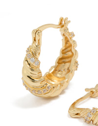 Detailed view of gold plated twist huggie earrings with cubic zirconia close up view - link has visual effect only