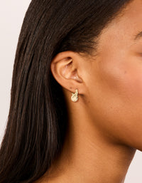 Featuring gold plated wavy hoop earrings with statement style on ear view - link has visual effect only