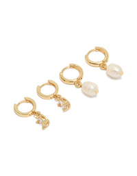 Showcasing pearl huggie hoop 2-pack earrings crafted from gold plated cubic zirconia and crystal in ivory front view - link has visual effect only