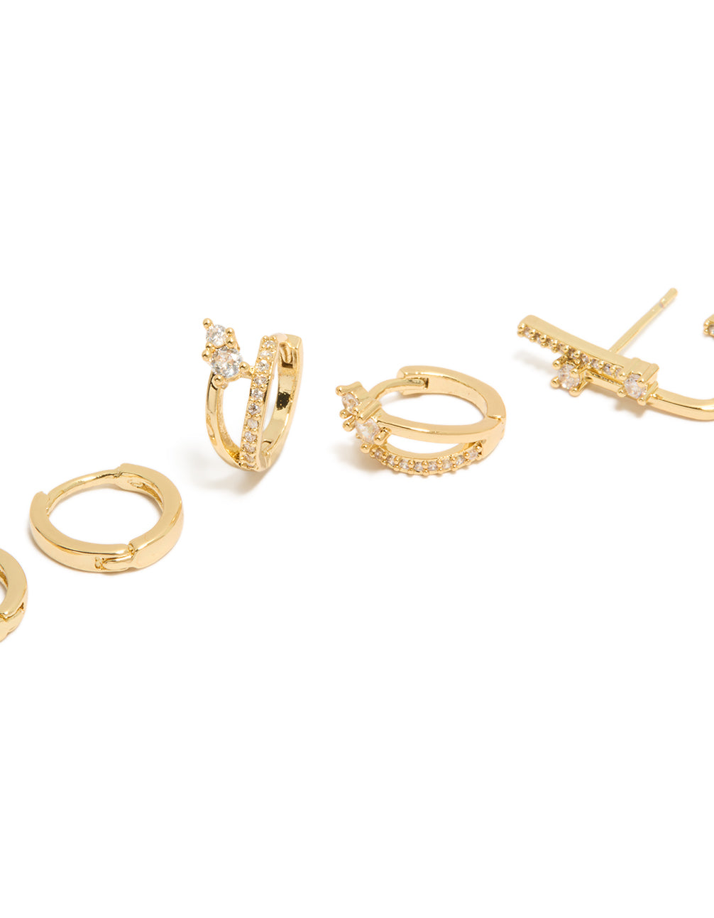 Designed with gold plated cubic zirconia studs and double cuff huggie earrings in a 3-pack, crystal accents, and clear color tones close up view