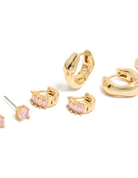 Showcasing gold plated pink cubic zirconia stud and huggie earrings in a 4-pack with chunky style descriptor, baguette stone cut close up view - link has visual effect only