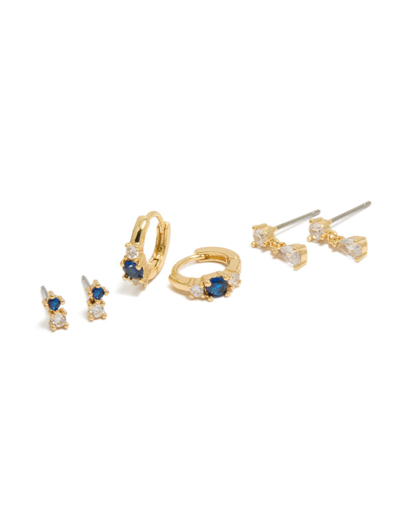 Showcasing gold plated mixed cut blue cubic zirconia mini earrings in a 3-pack with crystal huggie closure front view