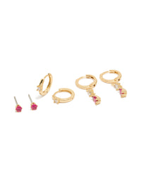 Dainty gold plated studs and huggie earrings 3-pack featuring dark pink cubic zirconia with crystal accents front view - link has visual effect only