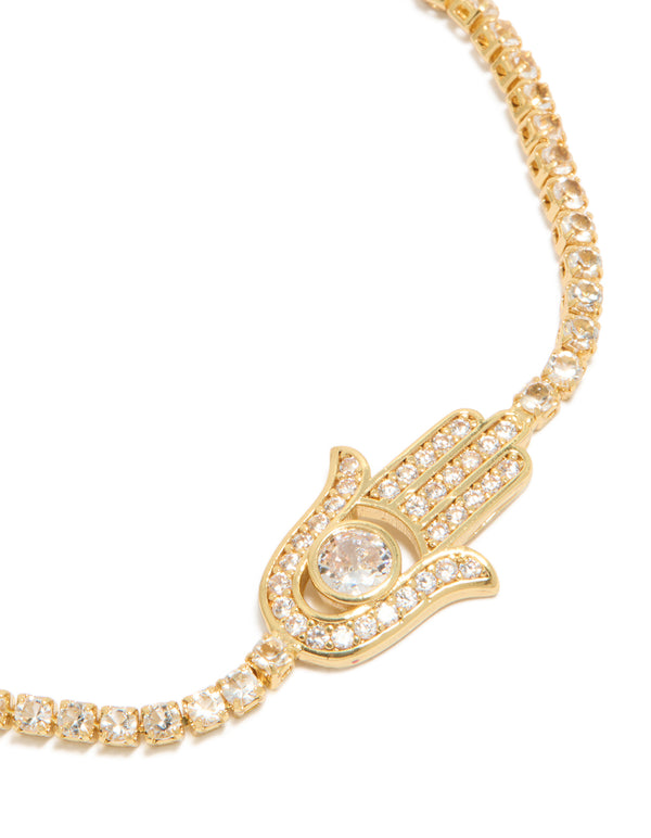 Showcasing a gold plated bracelet with hamsa hand and cubic zirconia stones in statement style close up view