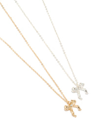 Discover a bow pendant necklace 2-pack in gold and silver close up view - link has visual effect only