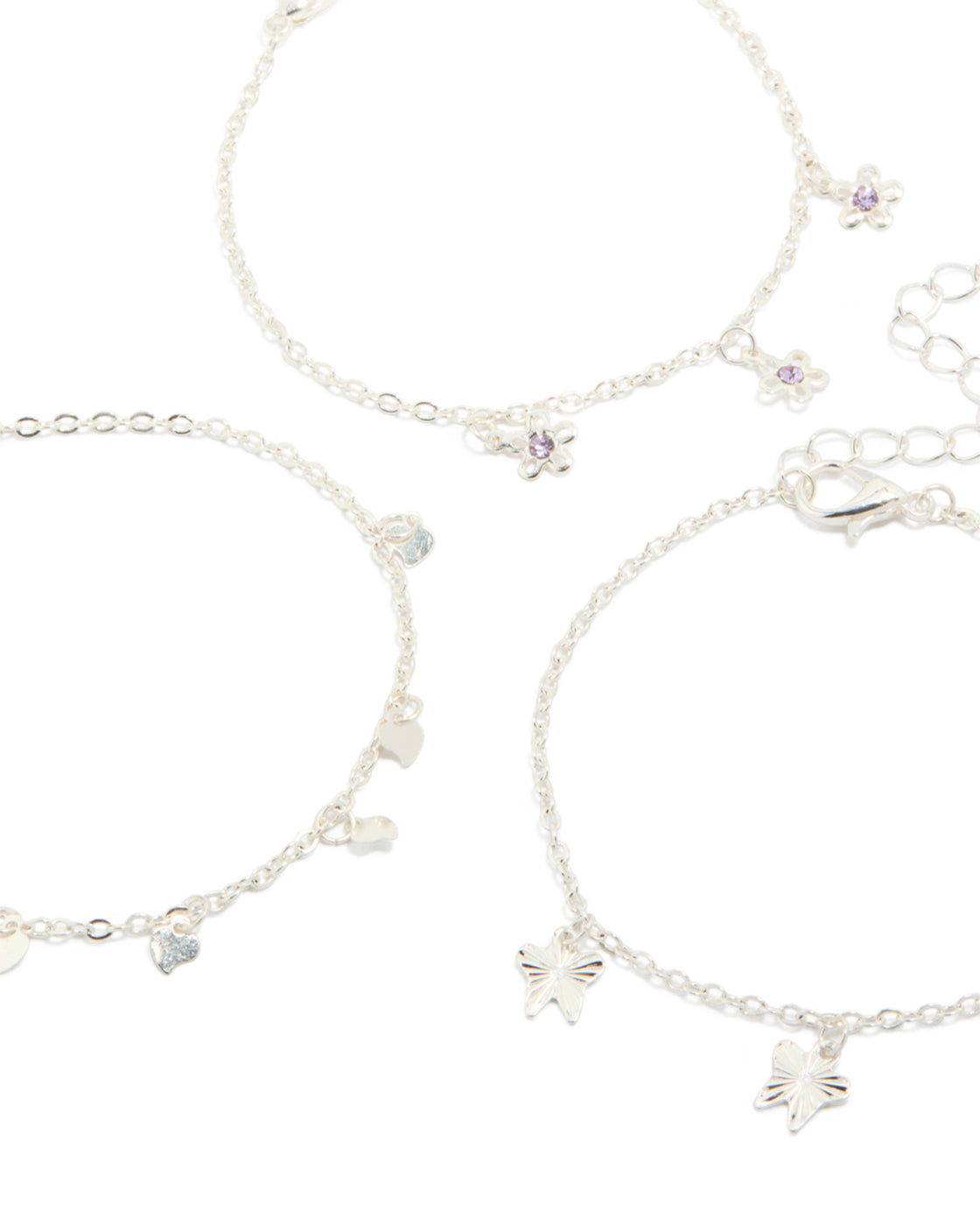 Crafted from silver, these dainty garden bracelets in a 3-pack feature butterfly, floral and heart charms close up view